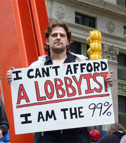Man with sign "I can't afford a lobbyist. I am the 99%"