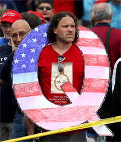Man wearing large Q at Trump rally