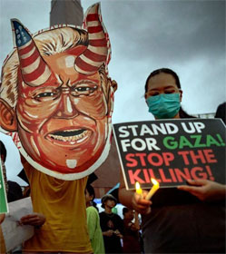 Pro-Palestine protesters in Manila displaying an effigy of Joe Biden with devil horns