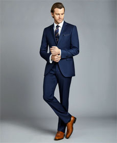 Man in blue suit and brown shoes
