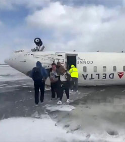 Delta plane upside down after crash landing in Toronto