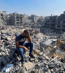 Gaza man in destroyed neighborhood