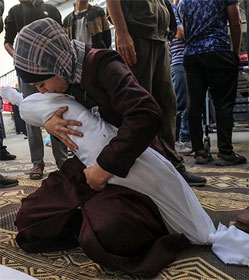 Gazan mother cradling dead child