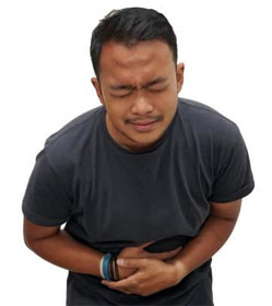 Constipated man clutching stomach