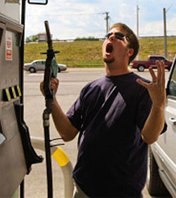 Frustrated man at gas pump