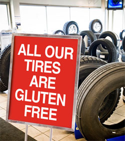 "All our tires are gluten free" sign at Fountain Tire