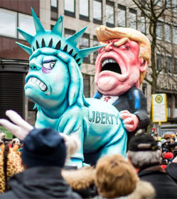 European parade float showing Trump humping the Statue of Liberty