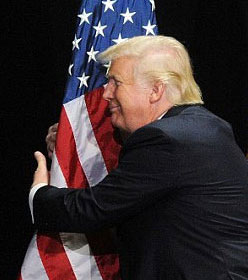Donald Trump hugging American flag