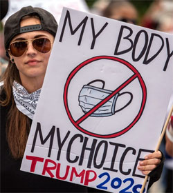 Woman holding No Masks sign, 'MY BODY MY CHOICE TRUMP 2020"
